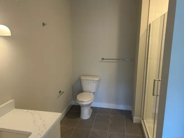 a bathroom with a toilet and a sink