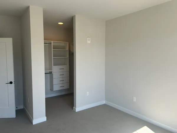 wooden floor and cabinet in an empty room