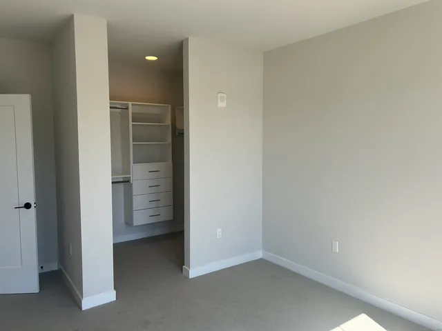 wooden floor and cabinet in an empty room