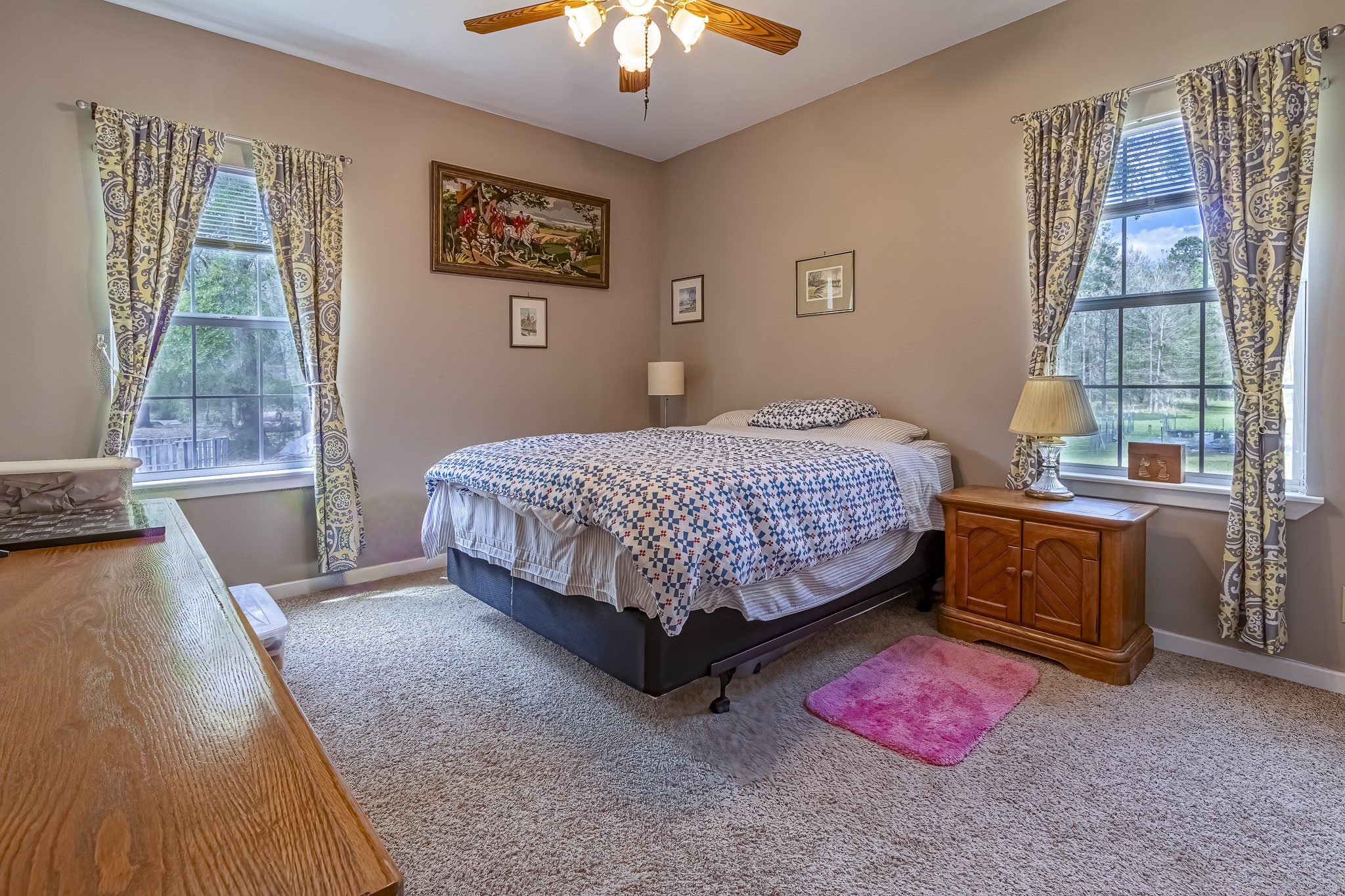 188 Pullin Road Corrigan, TX 75939 - Photo 25 of 50 a bedroom with a bed and a chandelier