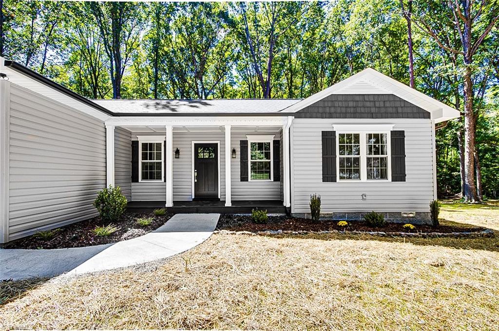 3150 Maple Way Staley, NC 27355 - Photo 2 of 27 Covered front porch is perfect for your rocking chairs