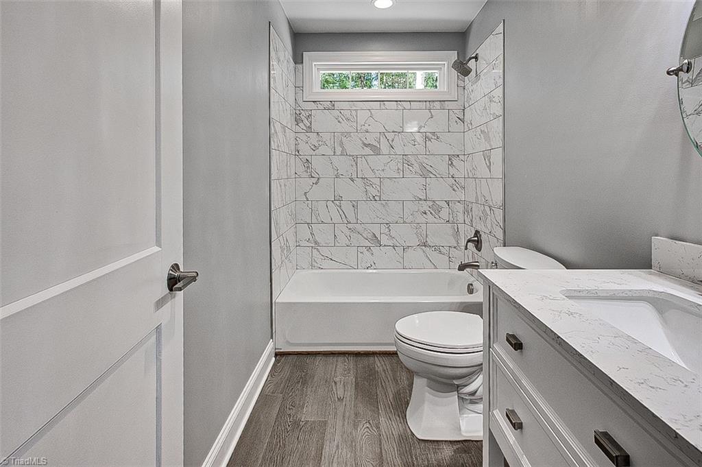 3150 Maple Way Staley, NC 27355 - Photo 24 of 27 Hall Bath, tub/shower combo with tile surround