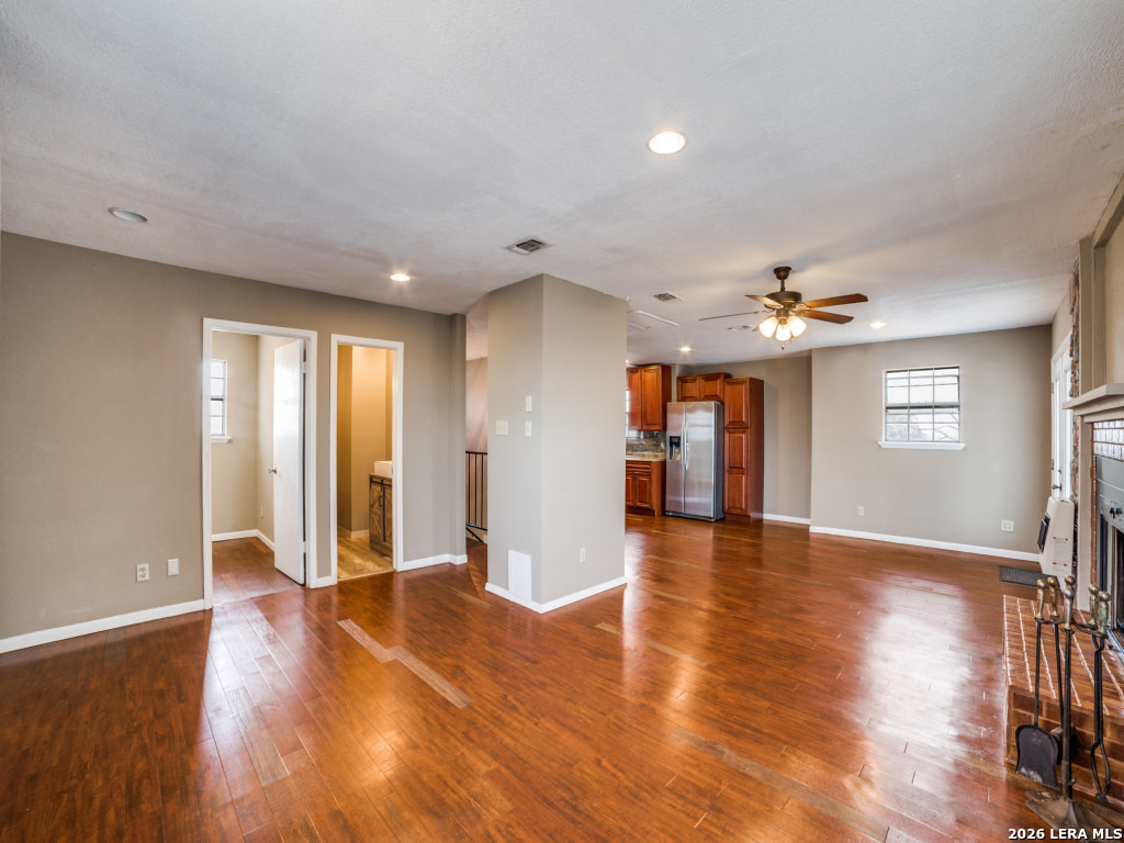 6953 Von Ormy Road Von Ormy, TX 78073 - Photo 12 of 28 a view of an empty room with window and wooden floor