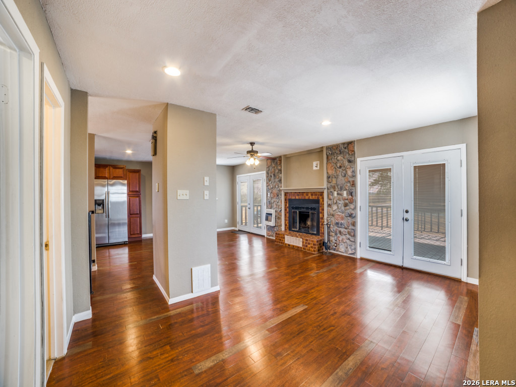 6953 Von Ormy Road Von Ormy, TX 78073 - Photo 14 of 28 a view of a livingroom with furniture and wooden floor