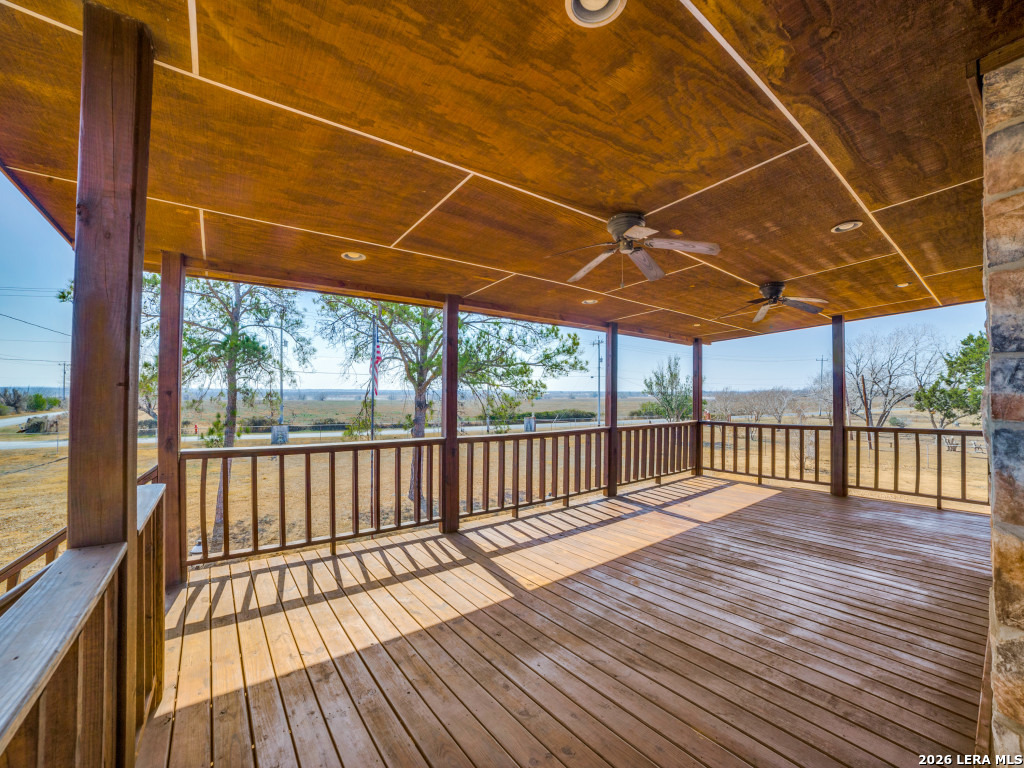 6953 Von Ormy Road Von Ormy, TX 78073 - Photo 3 of 28 a view of porch with wooden floor
