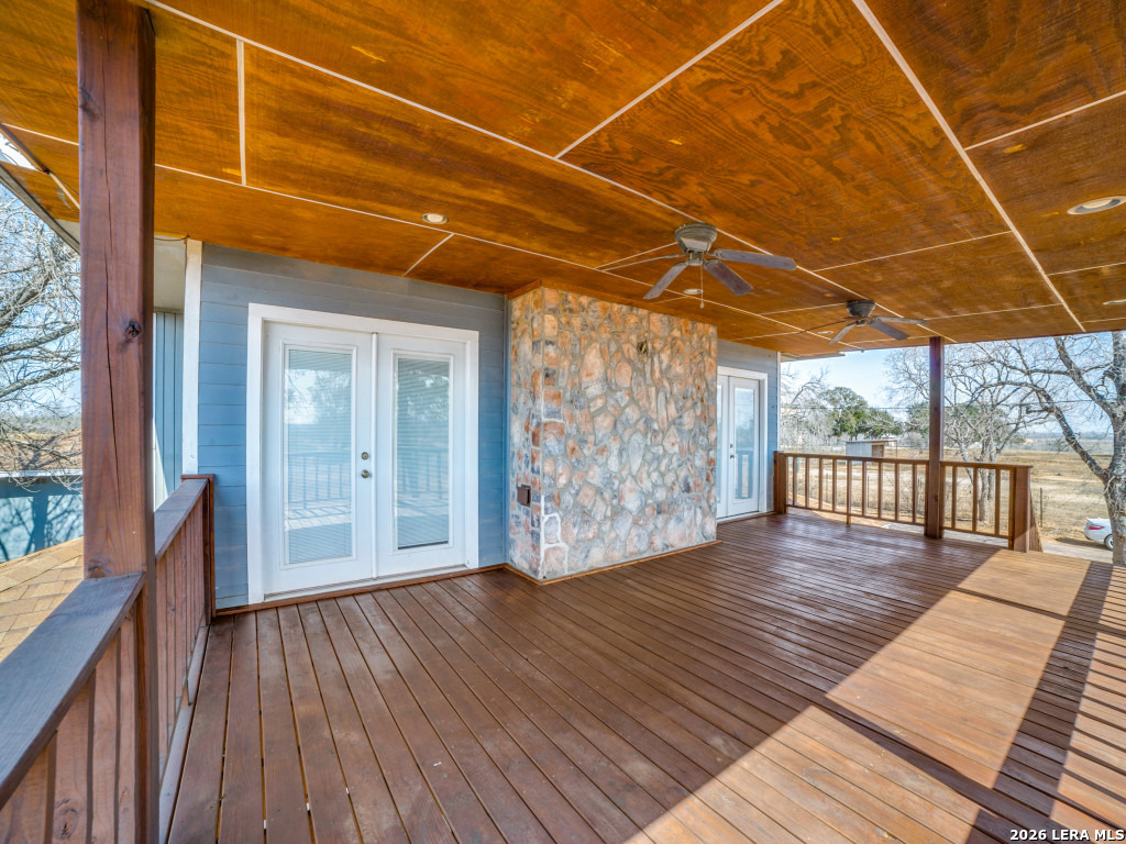 6953 Von Ormy Road Von Ormy, TX 78073 - Photo 4 of 28 a view of an empty room with wooden floor and a window