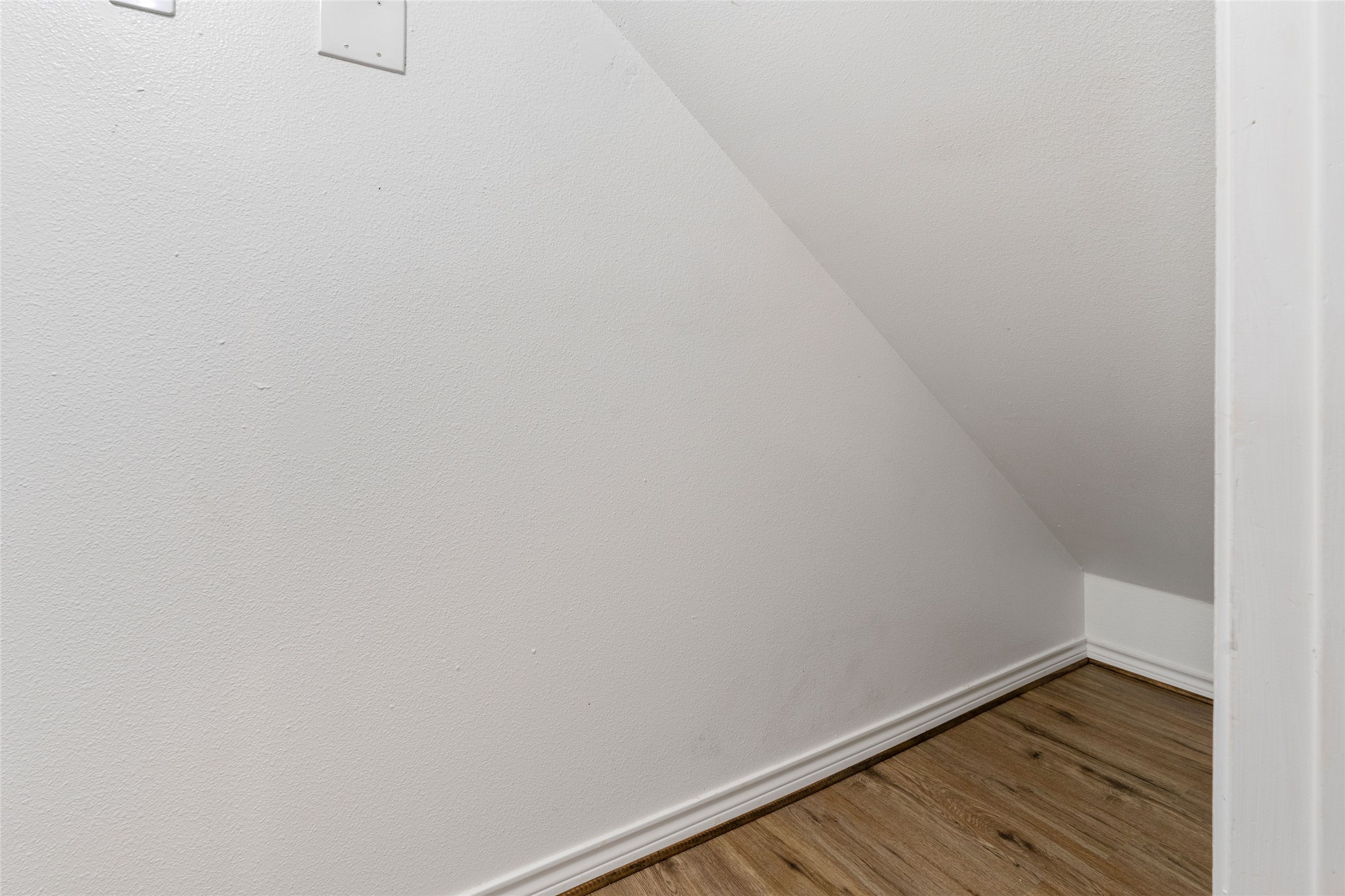 210 Brazos Street, Unit 102 Brazoria, TX 77422 - Photo 11 of 20 a view of a small space with wooden floor and a window