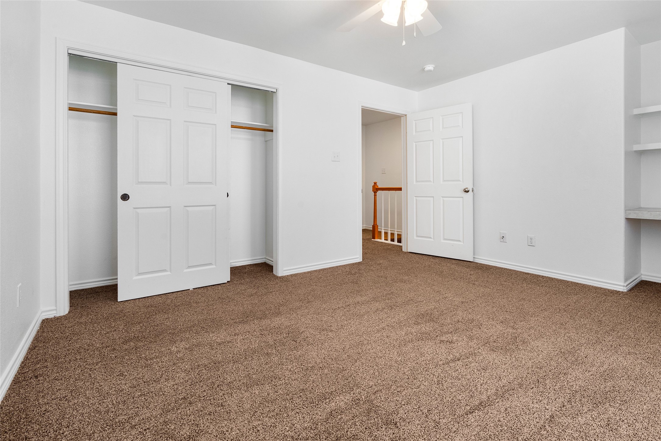 210 Brazos Street, Unit 102 Brazoria, TX 77422 - Photo 14 of 20 a view of an empty room with a ceiling fan