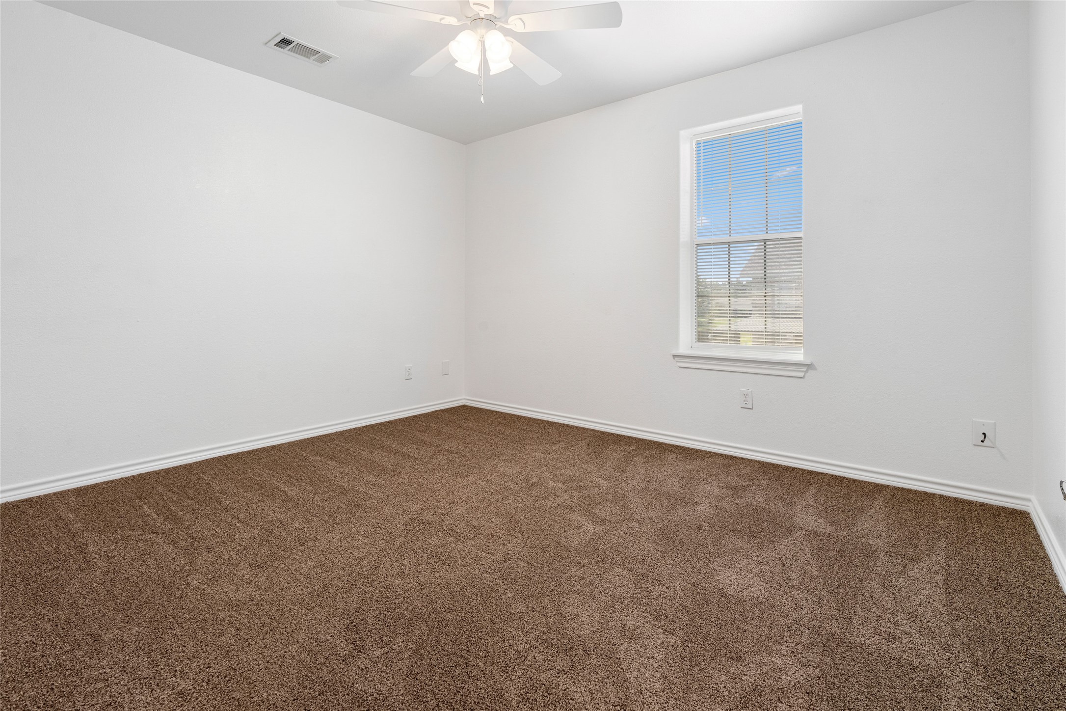 210 Brazos Street, Unit 102 Brazoria, TX 77422 - Photo 15 of 20 an empty room with a window