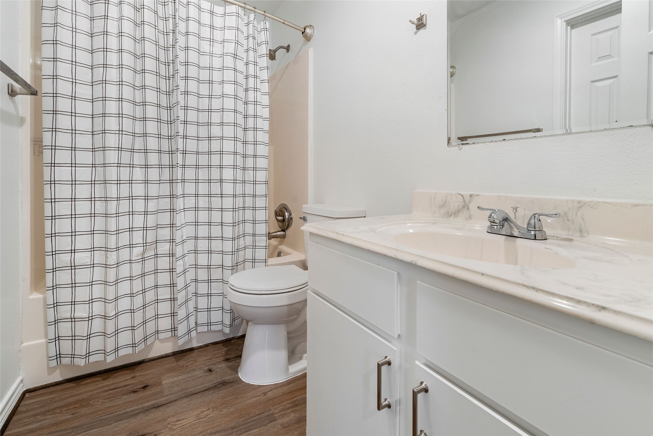 210 Brazos Street, Unit 102 Brazoria, TX 77422 - Photo 18 of 20 a bathroom with a sink toilet and shower