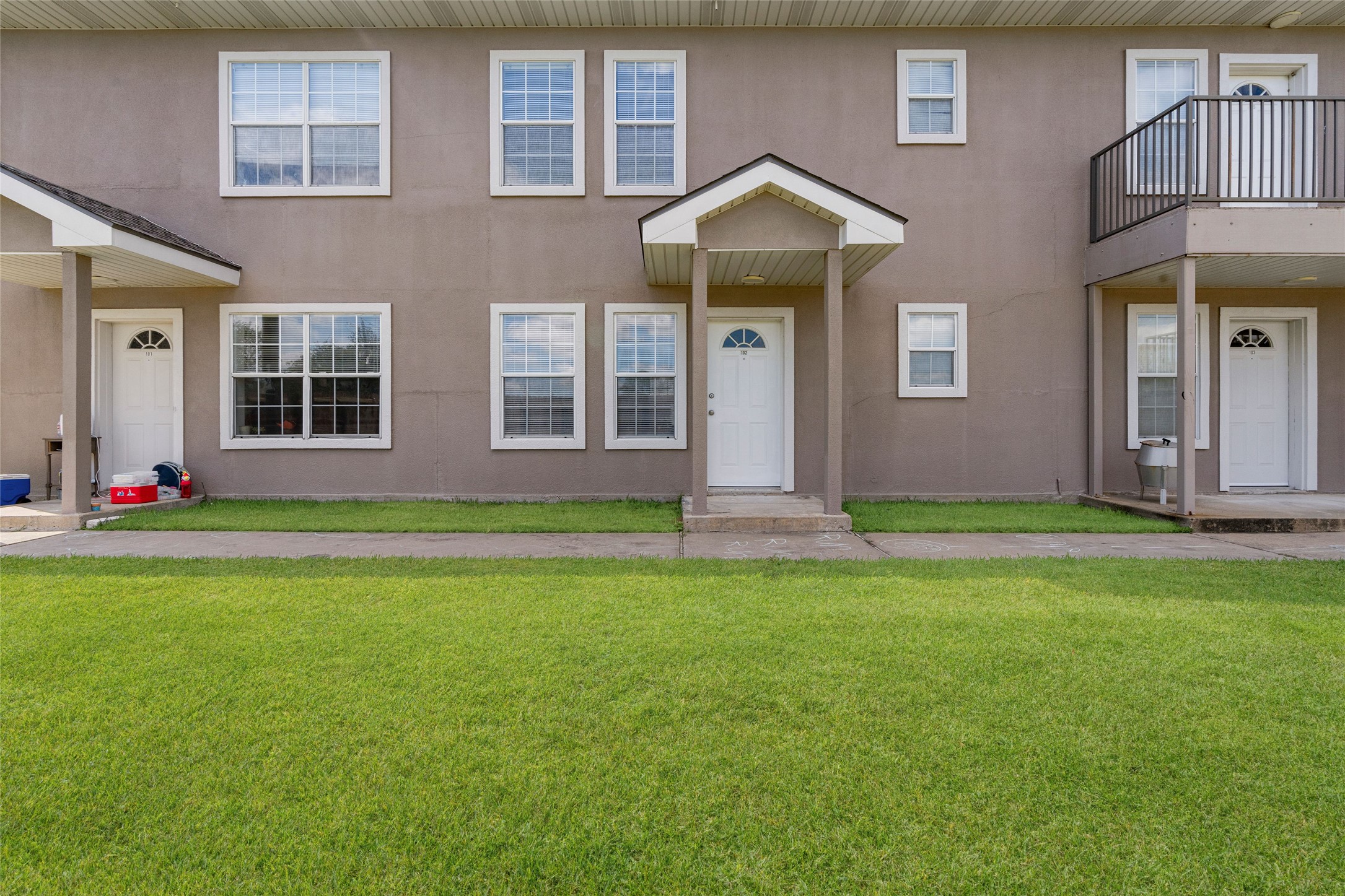 210 Brazos Street, Unit 102 Brazoria, TX 77422 - Photo 19 of 20 a front view of a house with garden