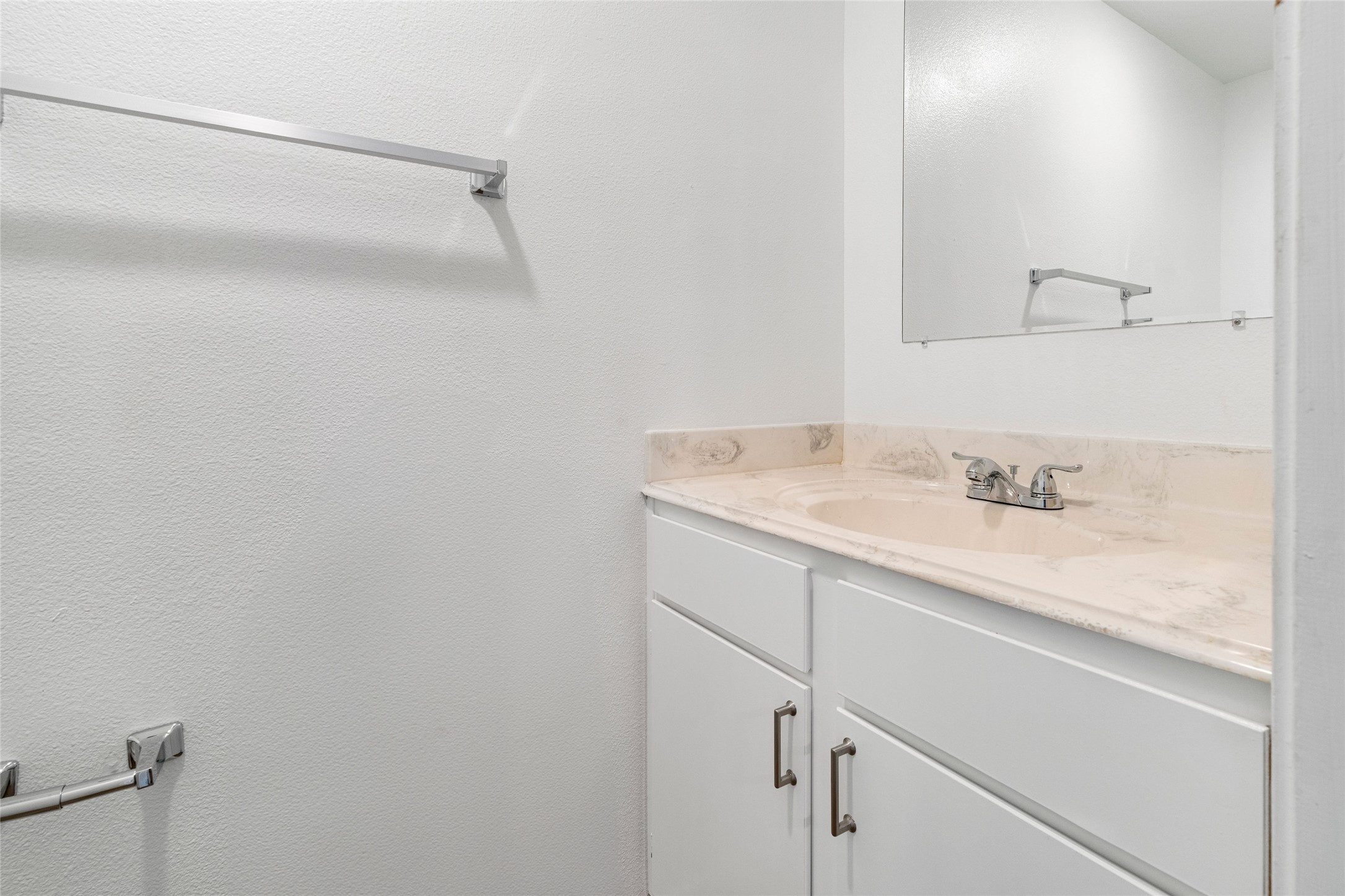 210 Brazos Street, Unit 102 Brazoria, TX 77422 - Photo 7 of 20 a bathroom with a granite countertop sink and vanity