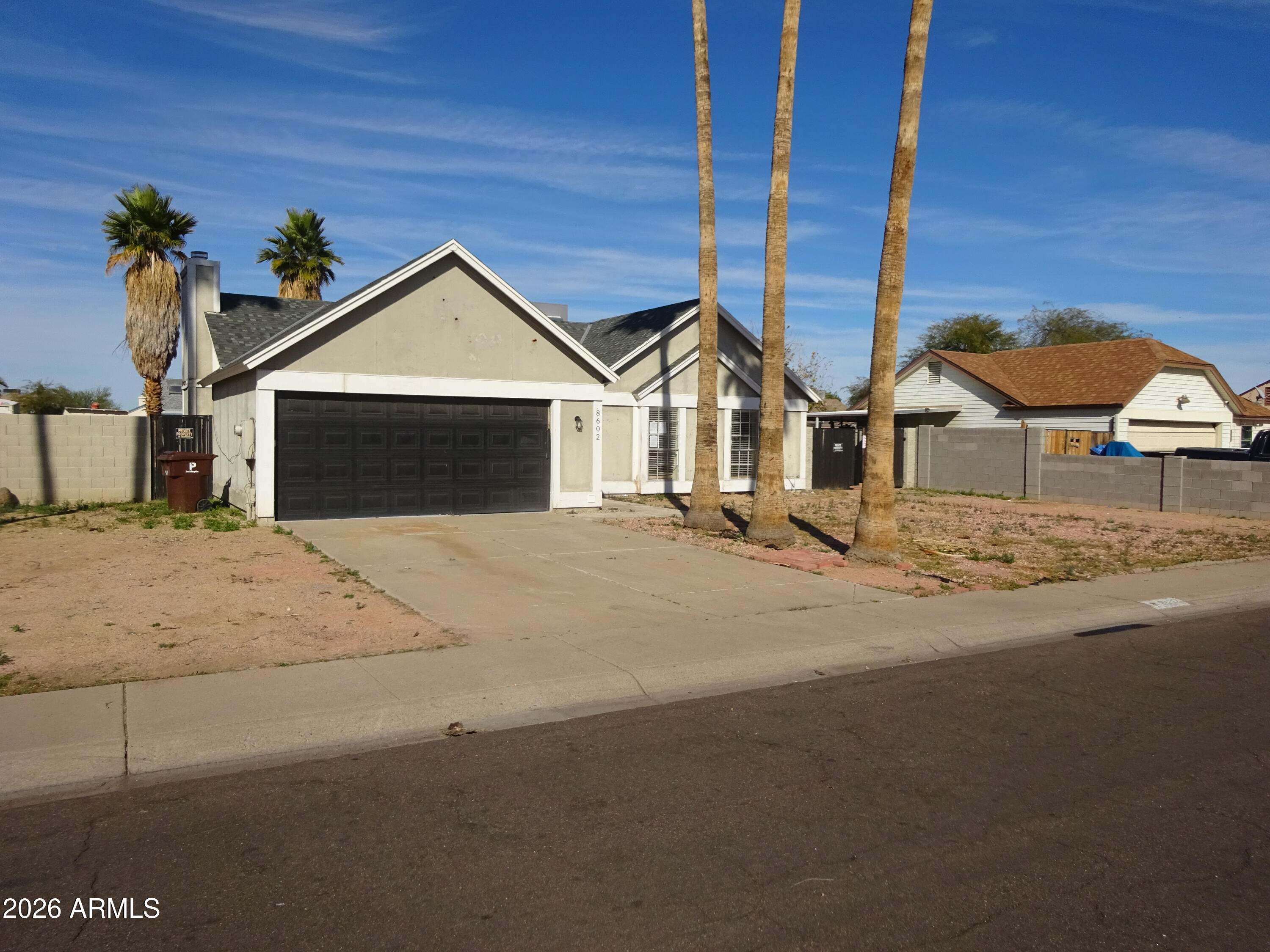 8602 West Wethersfield Road Peoria, AZ 85381 - Photo 3 of 26 a view of the house with a street