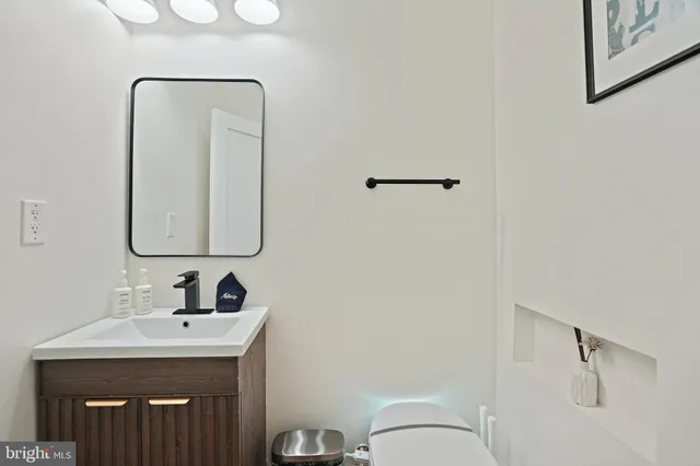 a large bed sitting in a bedroom next to a window