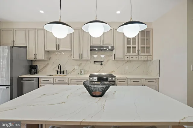 a utility room with sink dryer and washer