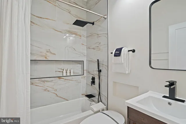 a bedroom with a bed and furniture