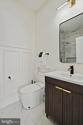 a bathroom with a bathtub shower sink and mirror