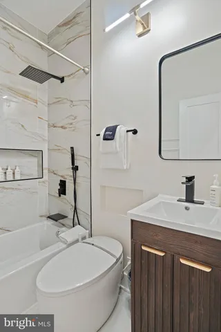 a living room with furniture a rug and a window