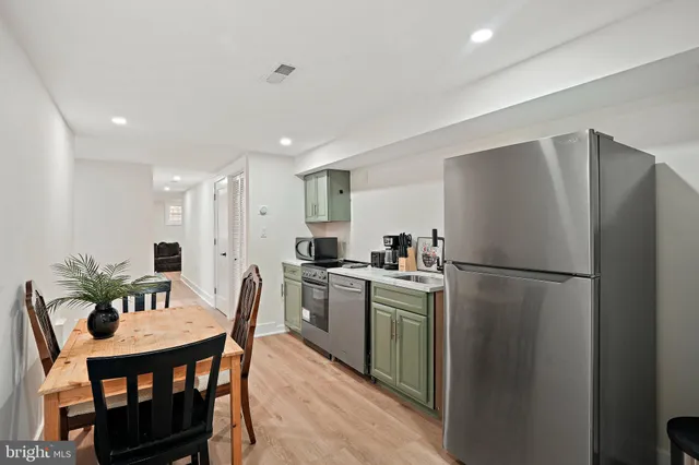 a bedroom with a bed and a wall painting