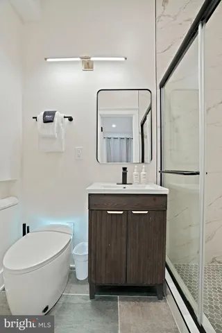 a bedroom with a bed and a wall painting