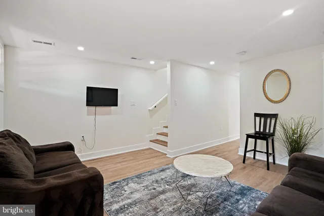 a spacious bedroom with a bed and a shower