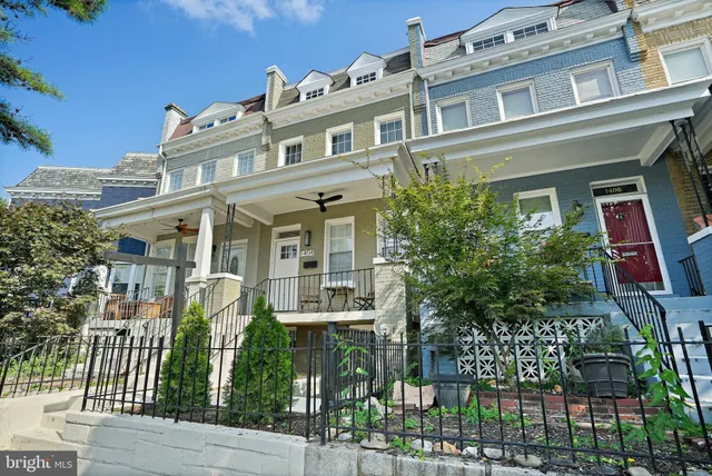 a view of a building with sitting area