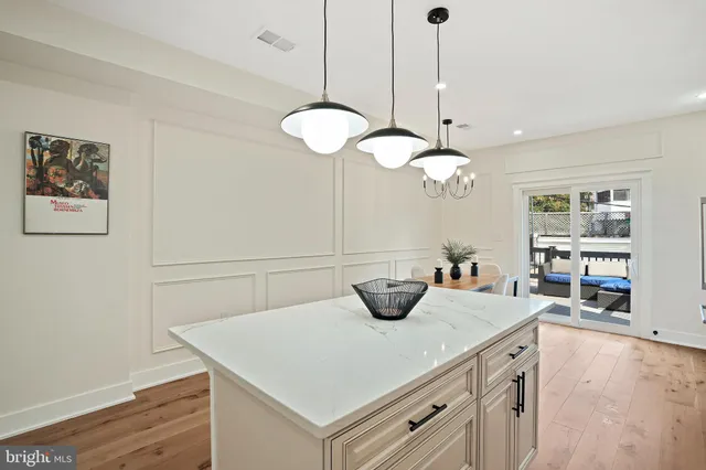 a kitchen with a table and chairs