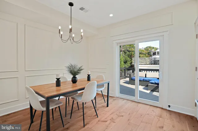 a kitchen with a table and chairs