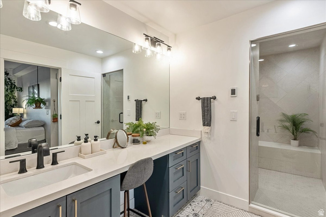 1800 Spring Oaks Drive Springville, UT 84663 - Photo 56 of 68 Full bathroom featuring vanity, a shower stall, connected bathroom, light tile patterned floors, and recessed lighting
