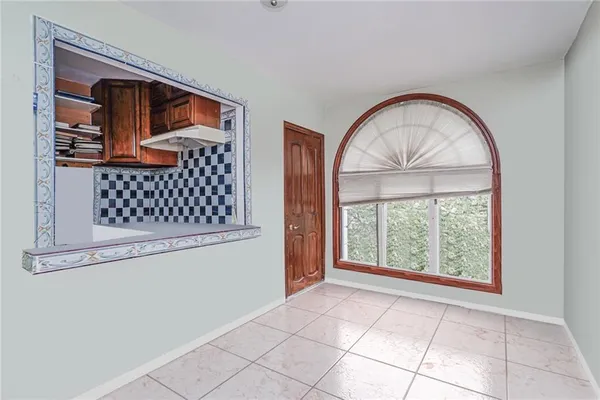 a kitchen with a sink cabinets and window