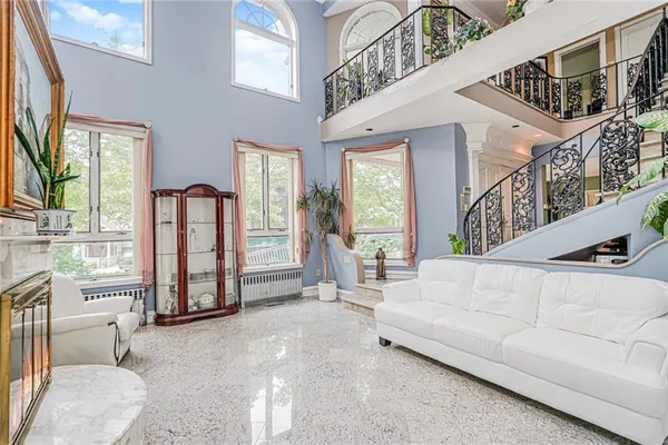 a kitchen with stainless steel appliances granite countertop a sink and a refrigerator