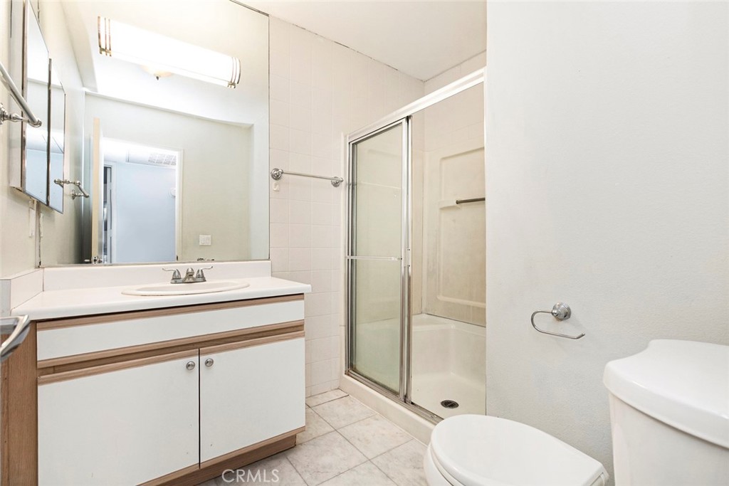 121 Sinclair Avenue, Unit 122 Glendale, CA 91206 - Photo 13 of 23 a bathroom with a sink a toilet and shower