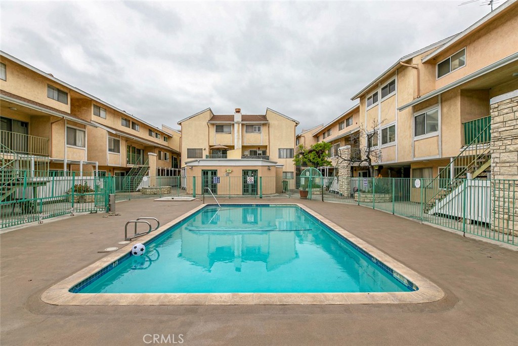 121 Sinclair Avenue, Unit 122 Glendale, CA 91206 - Photo 17 of 23 a swimming pool with outdoor seating and yard
