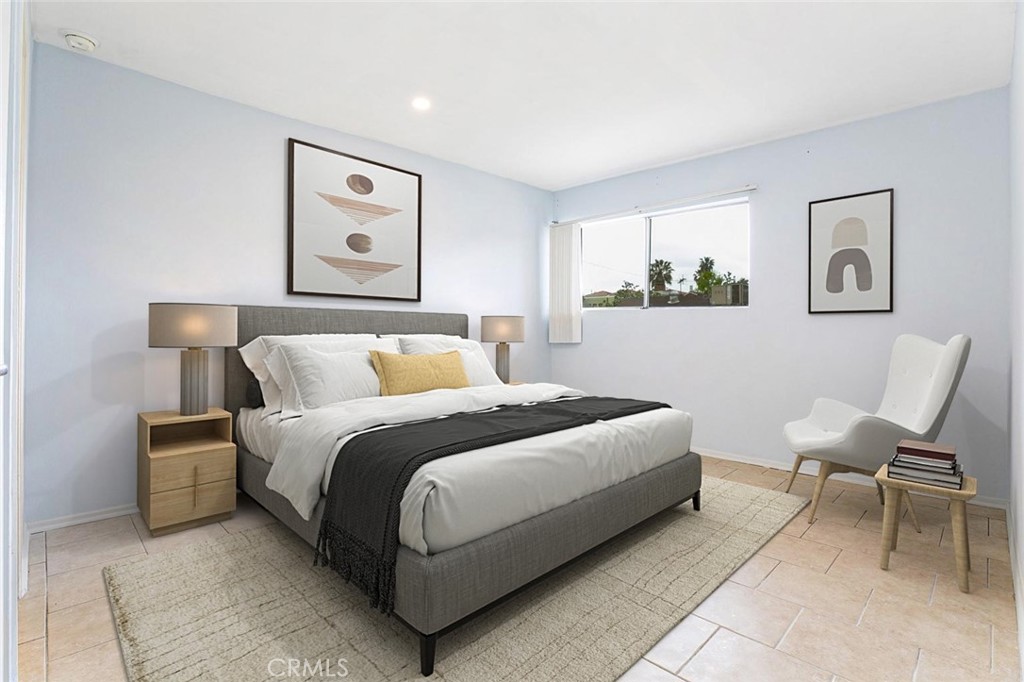 121 Sinclair Avenue, Unit 122 Glendale, CA 91206 - Photo 3 of 23 a bedroom with a bed and a chair