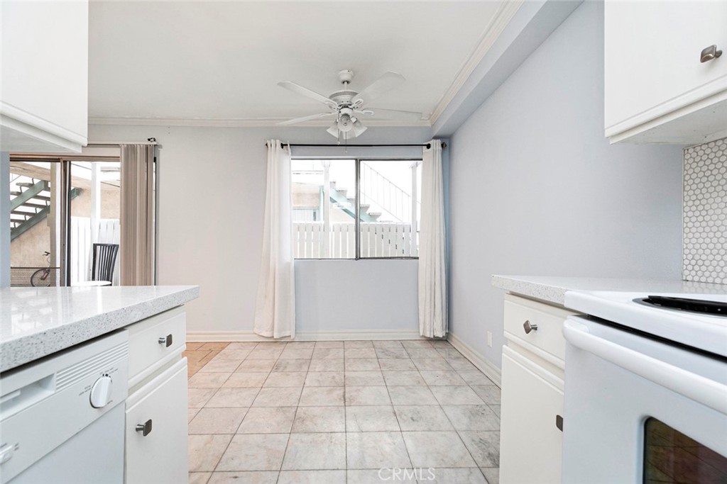 121 Sinclair Avenue, Unit 122 Glendale, CA 91206 - Photo 8 of 23 a room with a white cabinets and chandelier