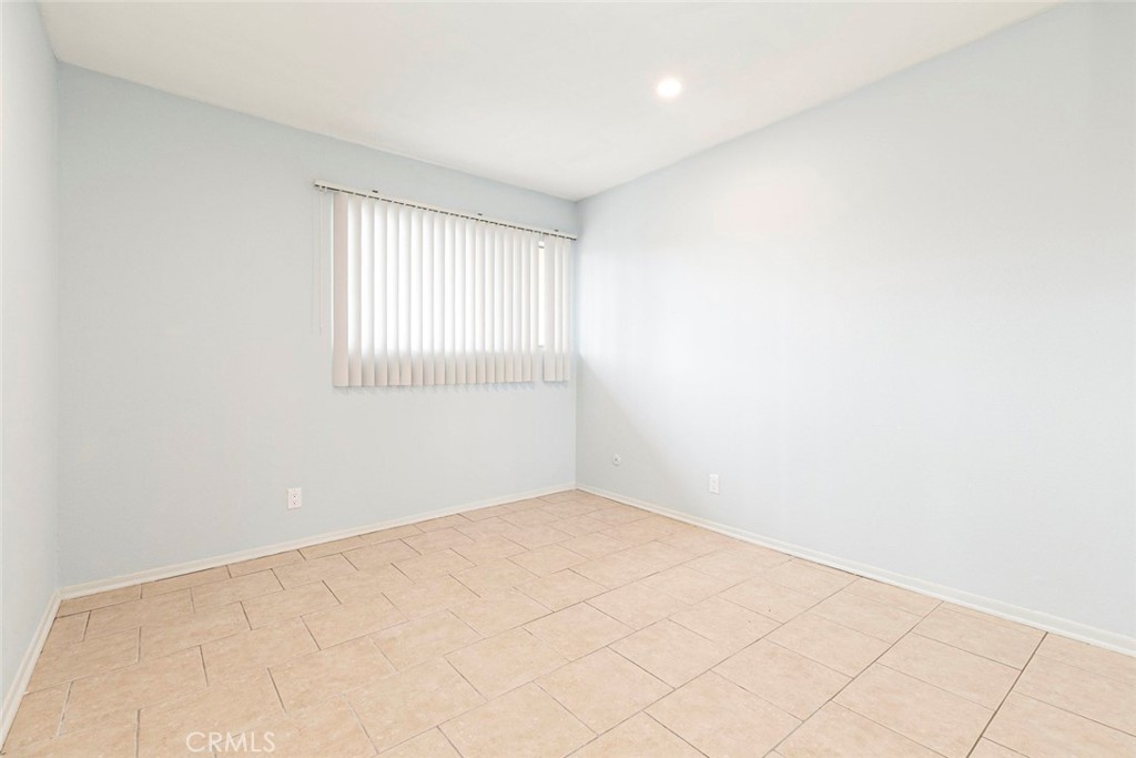 121 Sinclair Avenue, Unit 122 Glendale, CA 91206 - Photo 9 of 23 an empty room with windows