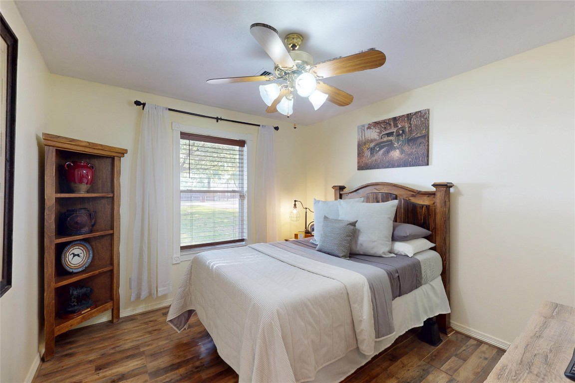 142 Sentinel Oaks Pinehurst, TX 77362 - Photo 21 of 41 a bedroom with bed and wooden floor