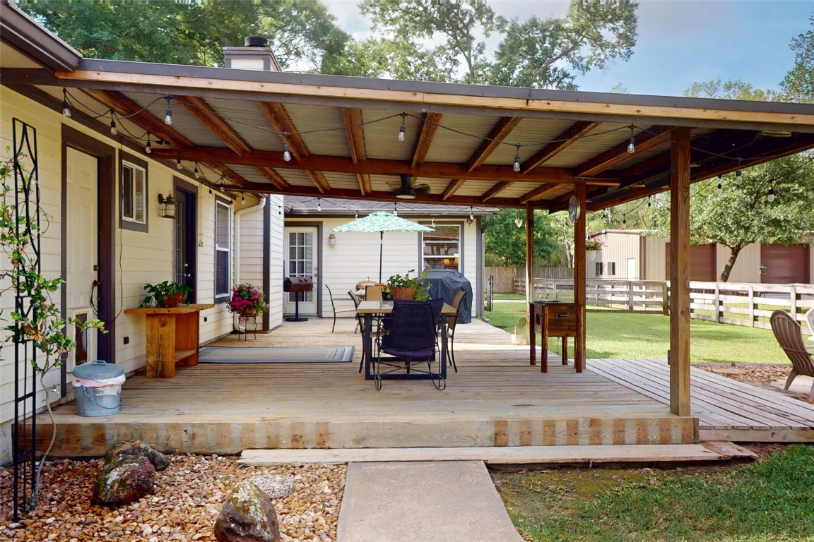 142 Sentinel Oaks Pinehurst, TX 77362 - Photo 26 of 41 Covered Patio with lighting.