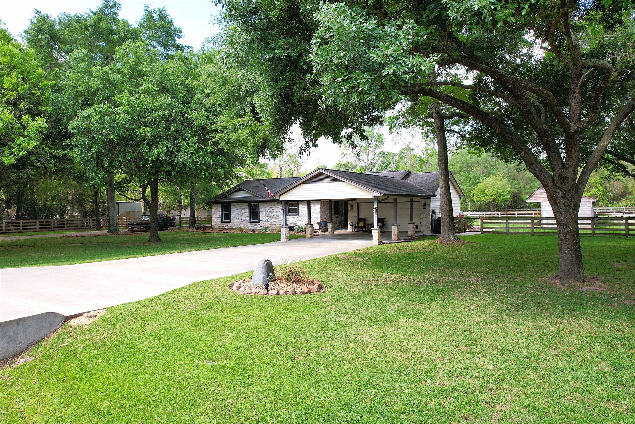 142 Sentinel Oaks Pinehurst, TX 77362 - Photo 3 of 41 a view of a house with a yard