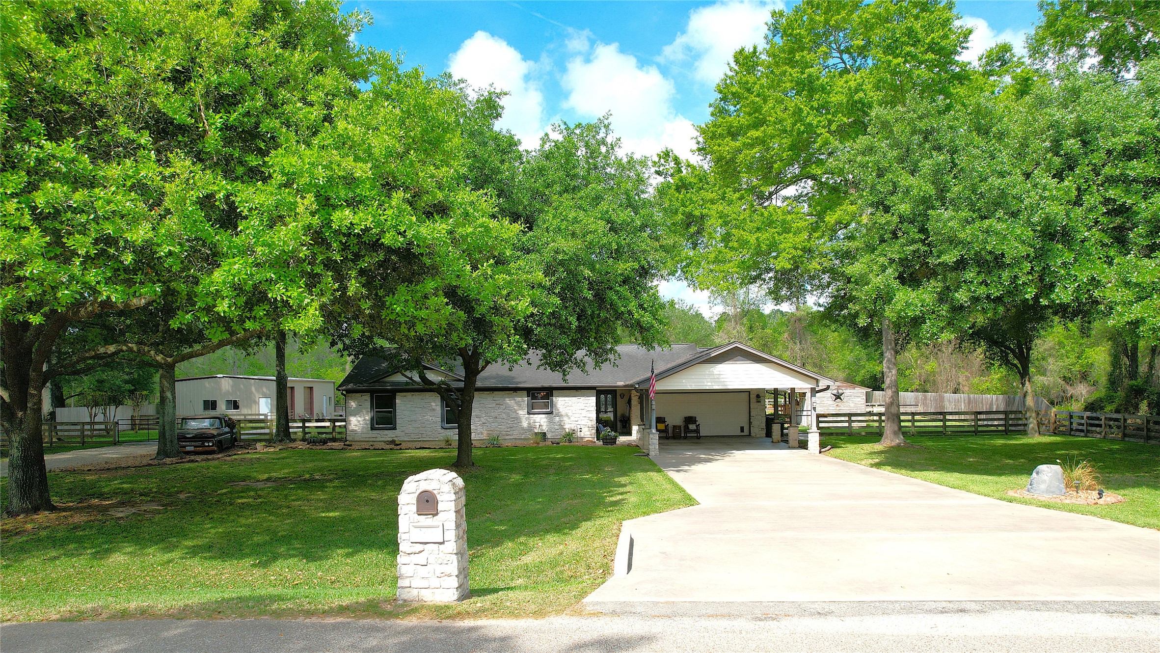 142 Sentinel Oaks Pinehurst, TX 77362 - Photo 36 of 41 a front view of a house with a yard and a porch