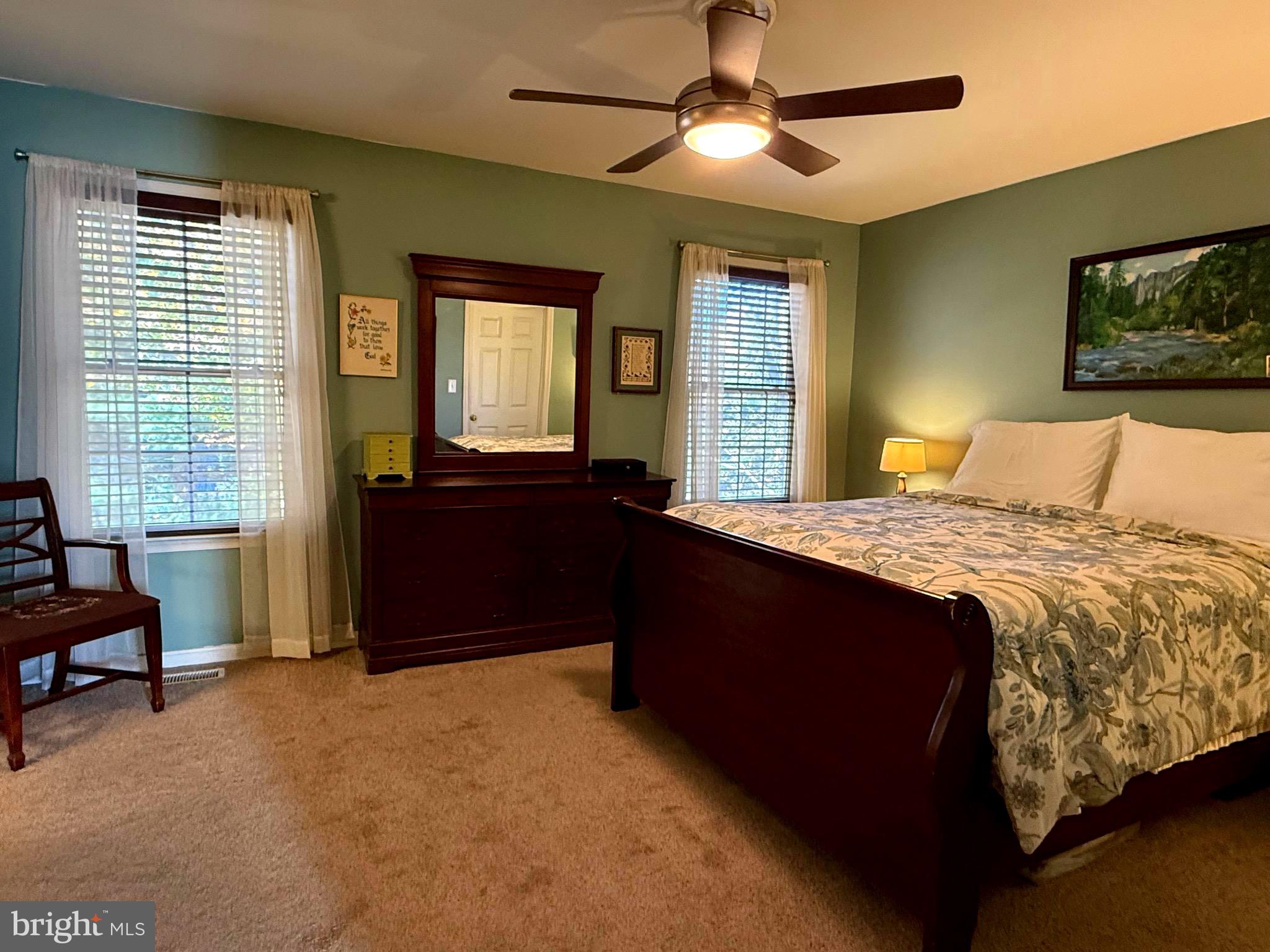 51 Finch Lane Falling Waters, WV 25419 - Photo 22 of 37 a bedroom with a bed and a chandelier