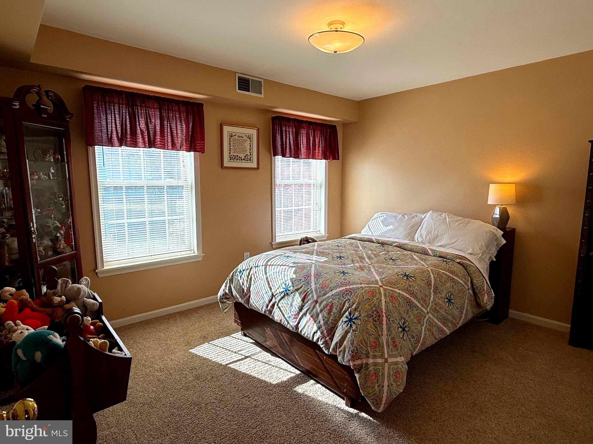 51 Finch Lane Falling Waters, WV 25419 - Photo 28 of 37 a spacious bedroom with a bed and a window