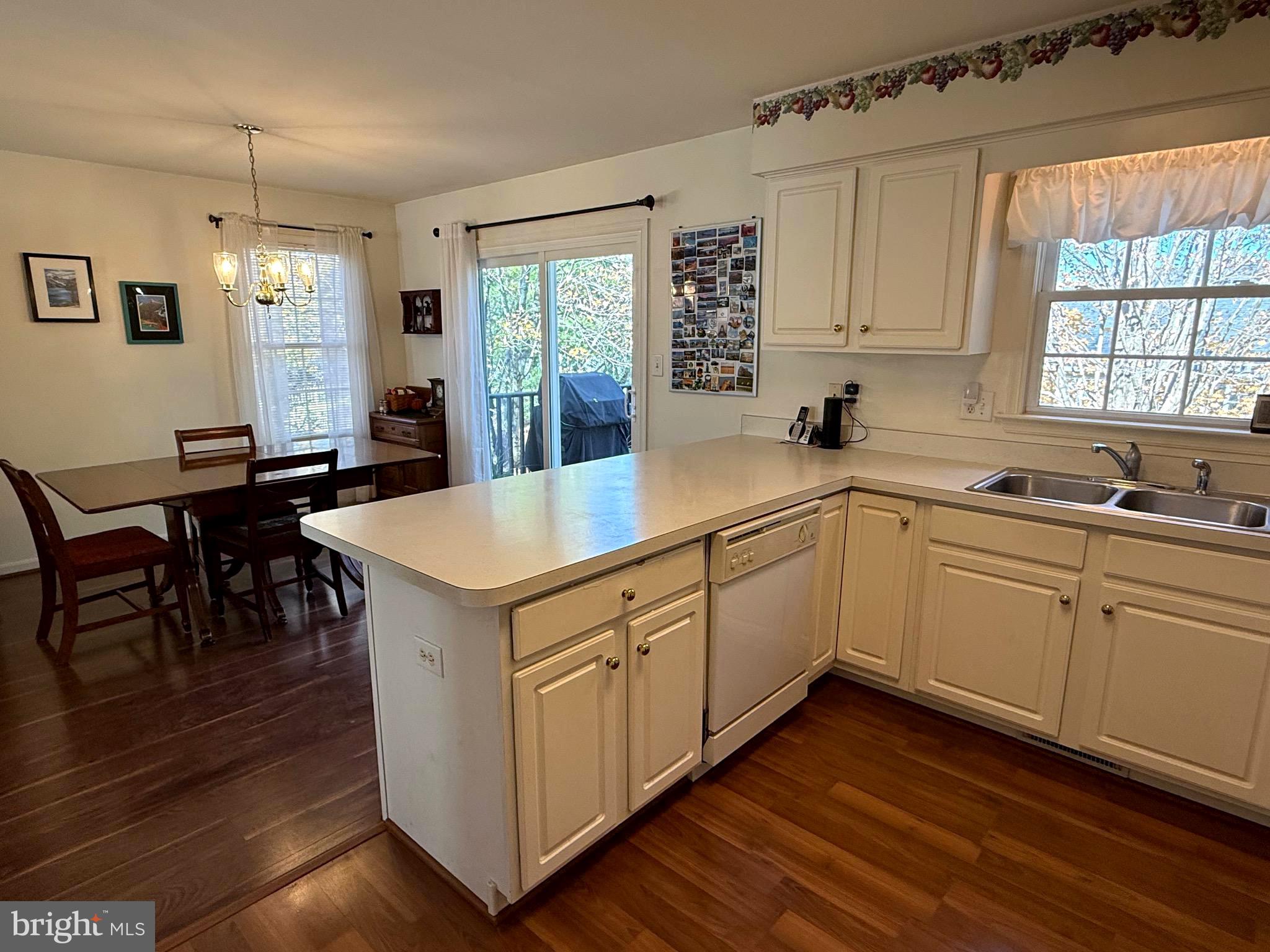 51 Finch Lane Falling Waters, WV 25419 - Photo 9 of 37 a kitchen that has a lot of cabinets in it and wooden floors
