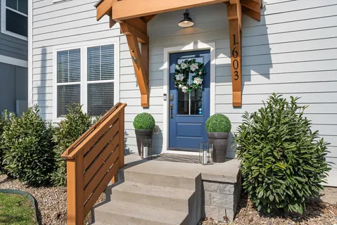 a view of a house with potted plants and a potted plant