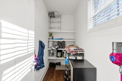 a bedroom with furniture and a book shelf