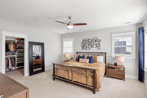 a bedroom with furniture and a chandelier