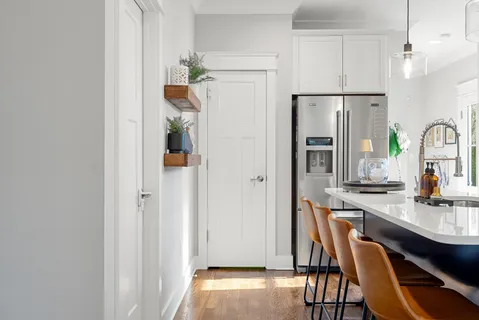 a kitchen with stainless steel appliances a refrigerator and a stove