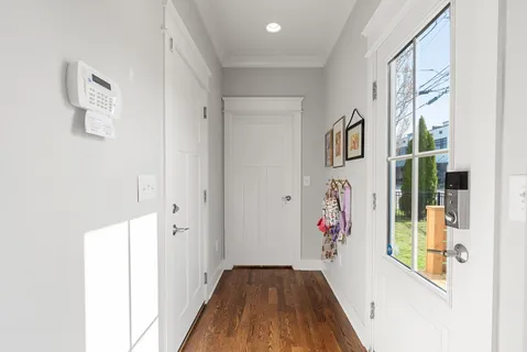 view of hallway with wooden floor