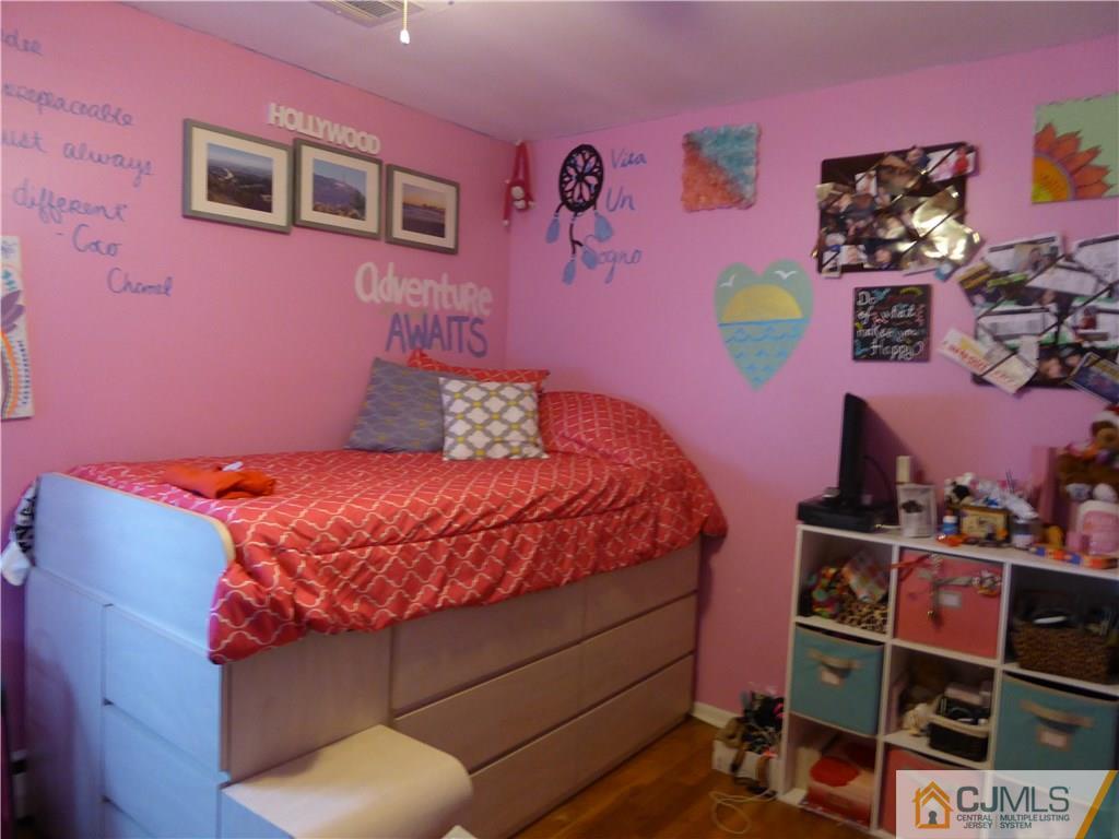 102 Stony Road Edison, NJ 08817 - Photo 12 of 21 a bedroom with a bed and a window