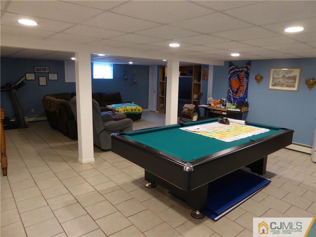 102 Stony Road Edison, NJ 08817 - Photo 14 of 21 a room with furniture pool table and window